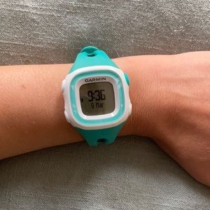 Teal Garmin forerunner 15 with charger